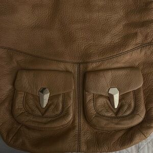 Oryany Light Brown Purse. Navy inside. Very soft leather.